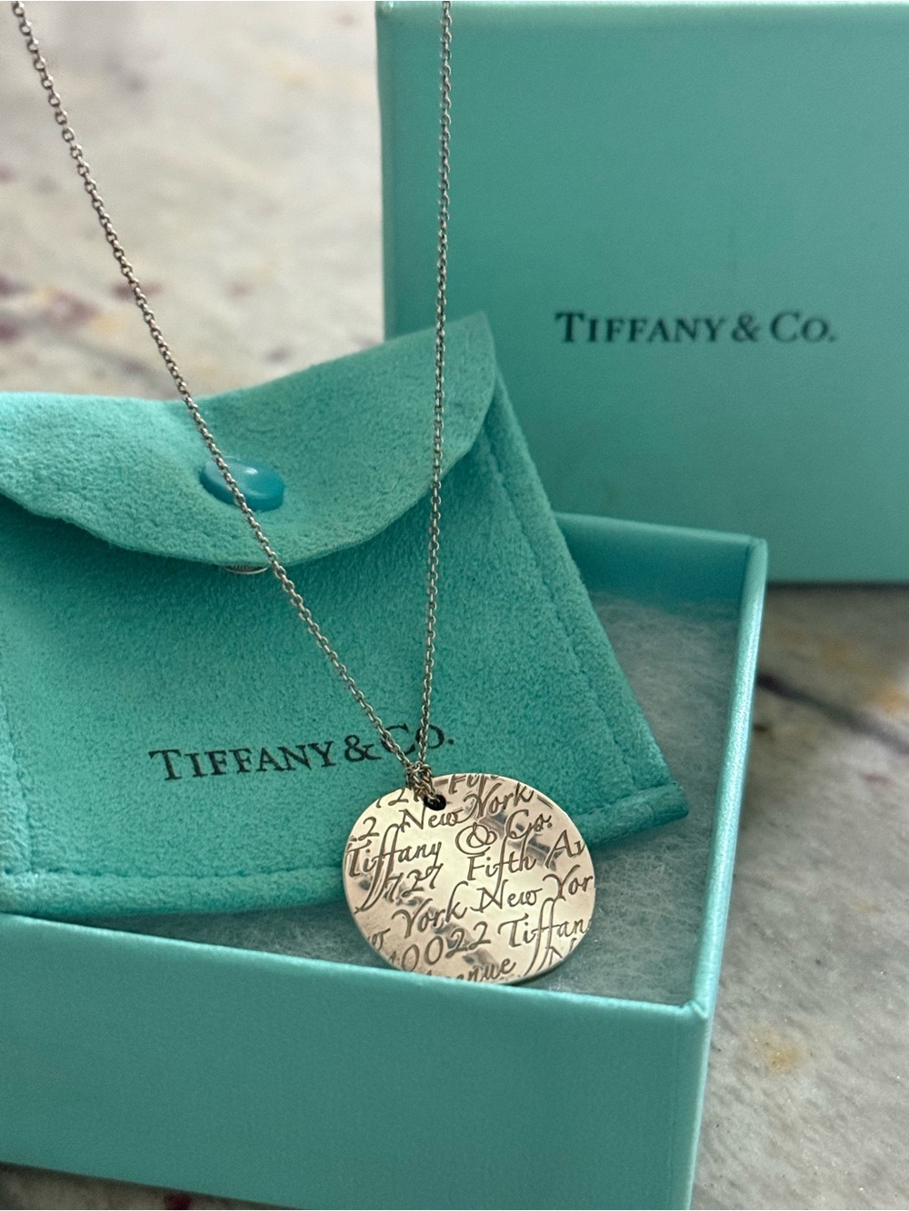Tiffany & Co. Silver Engraved Round “Notes” Pendant Necklace
